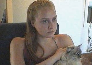 Jennifer Ringley candid portrait with retro webcam streaming aesthetic