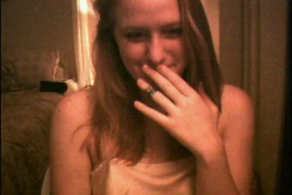 Jennifer Ringley candid smile portrait with retro internet webcam aesthetic