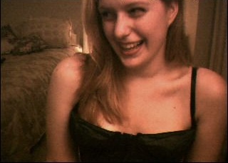 Jennifer Ringley laughing candid portrait with retro webcam influencer style