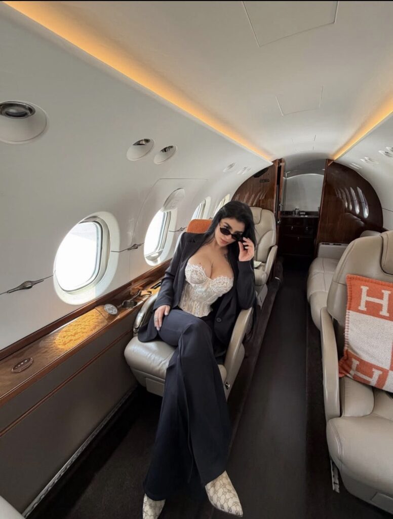 Karely Ruiz private jet lifestyle portrait with glamorous influencer aesthetic