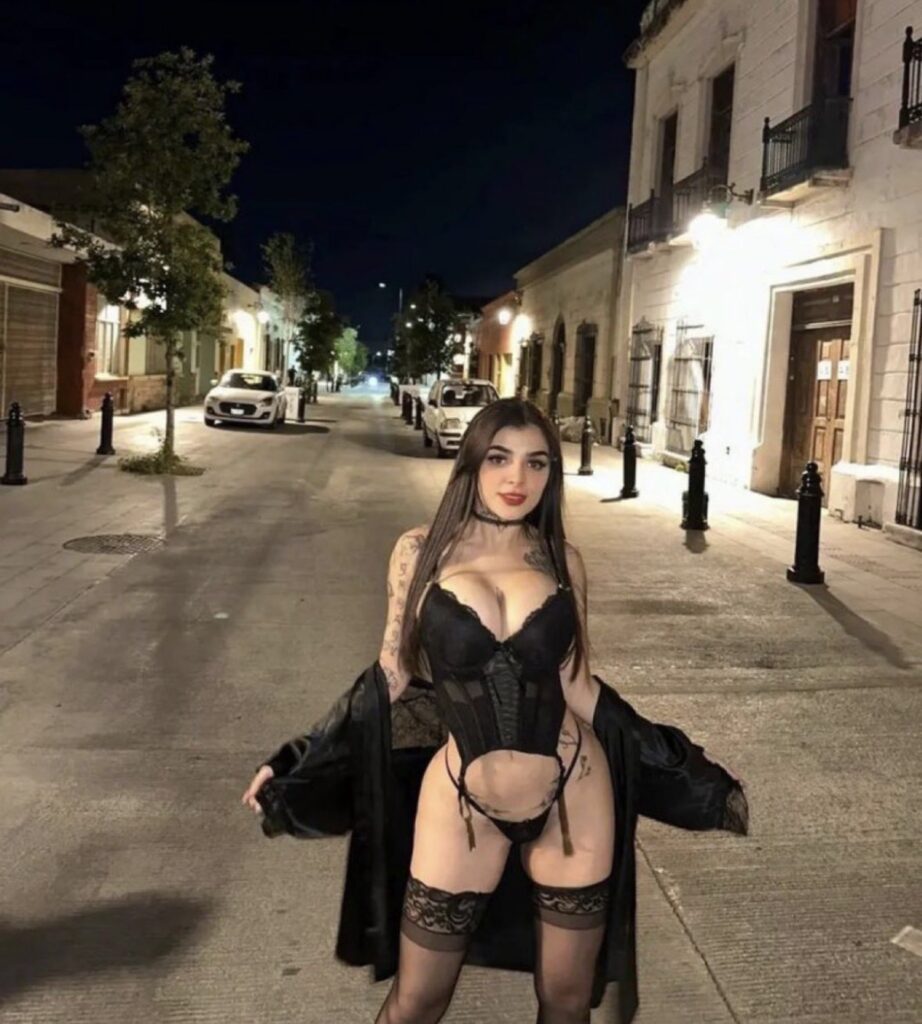 Karely Ruiz luxury nightlife glamour portrait with black stockings outfit and influencer aesthetic