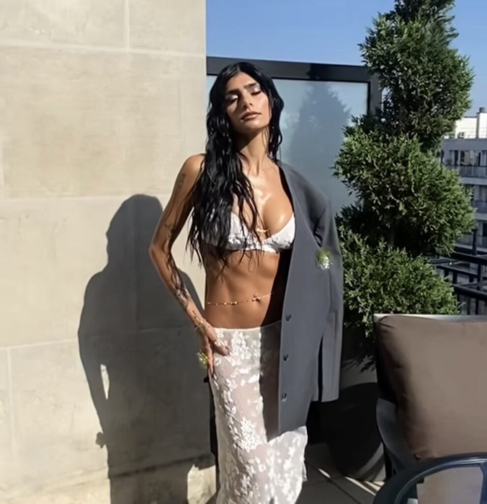Mia Khalifa rooftop fashion portrait with luxury influencer aesthetic