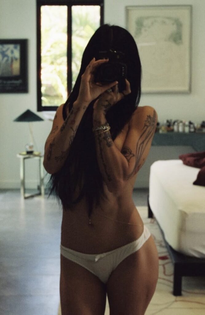 Mia Khalifa mirror selfie in white lingerie with glamorous influencer vibe