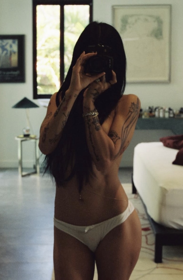 Mia Khalifa mirror selfie in white lingerie with glamorous influencer vibe