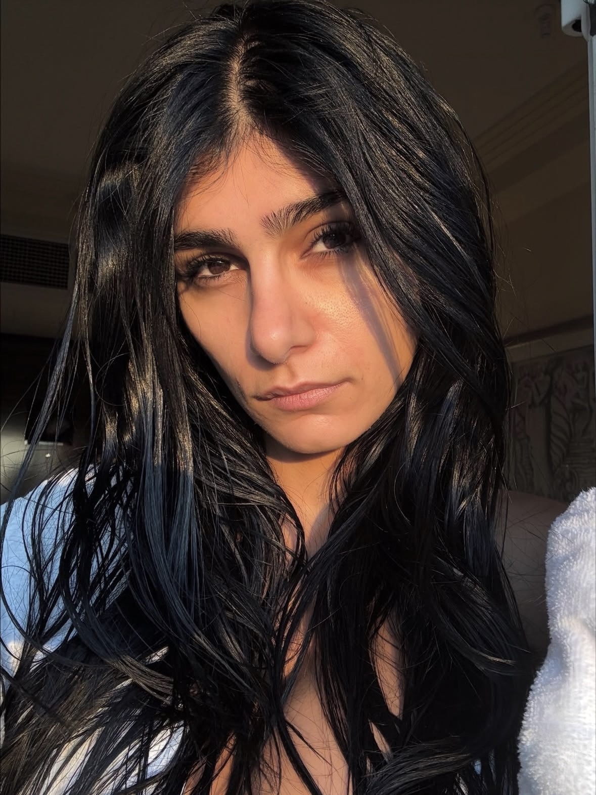 Mia Khalifa brunette beauty selfie with luxury influencer style