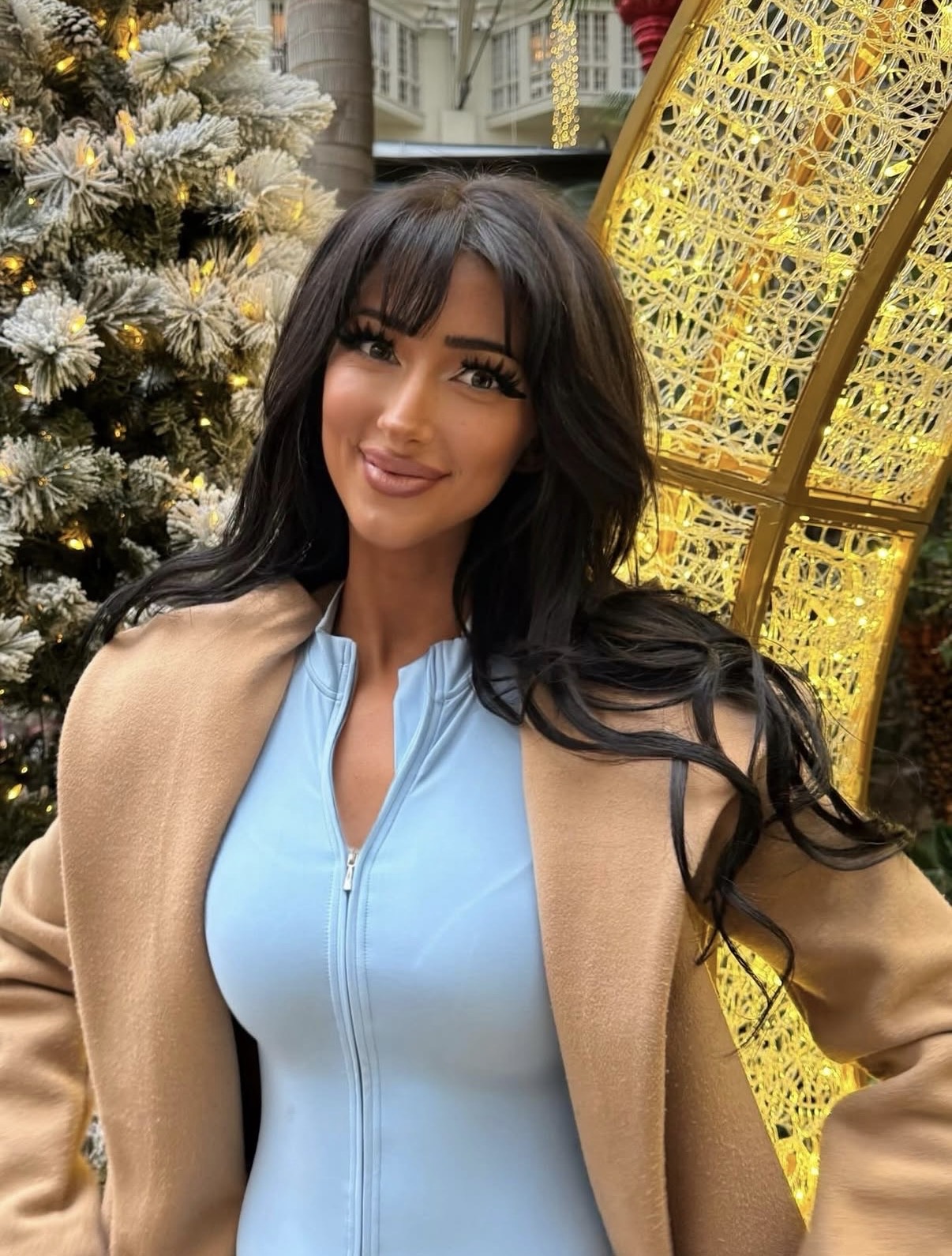 Nala Ray brunette fashion portrait outdoors with glamorous influencer vibe
