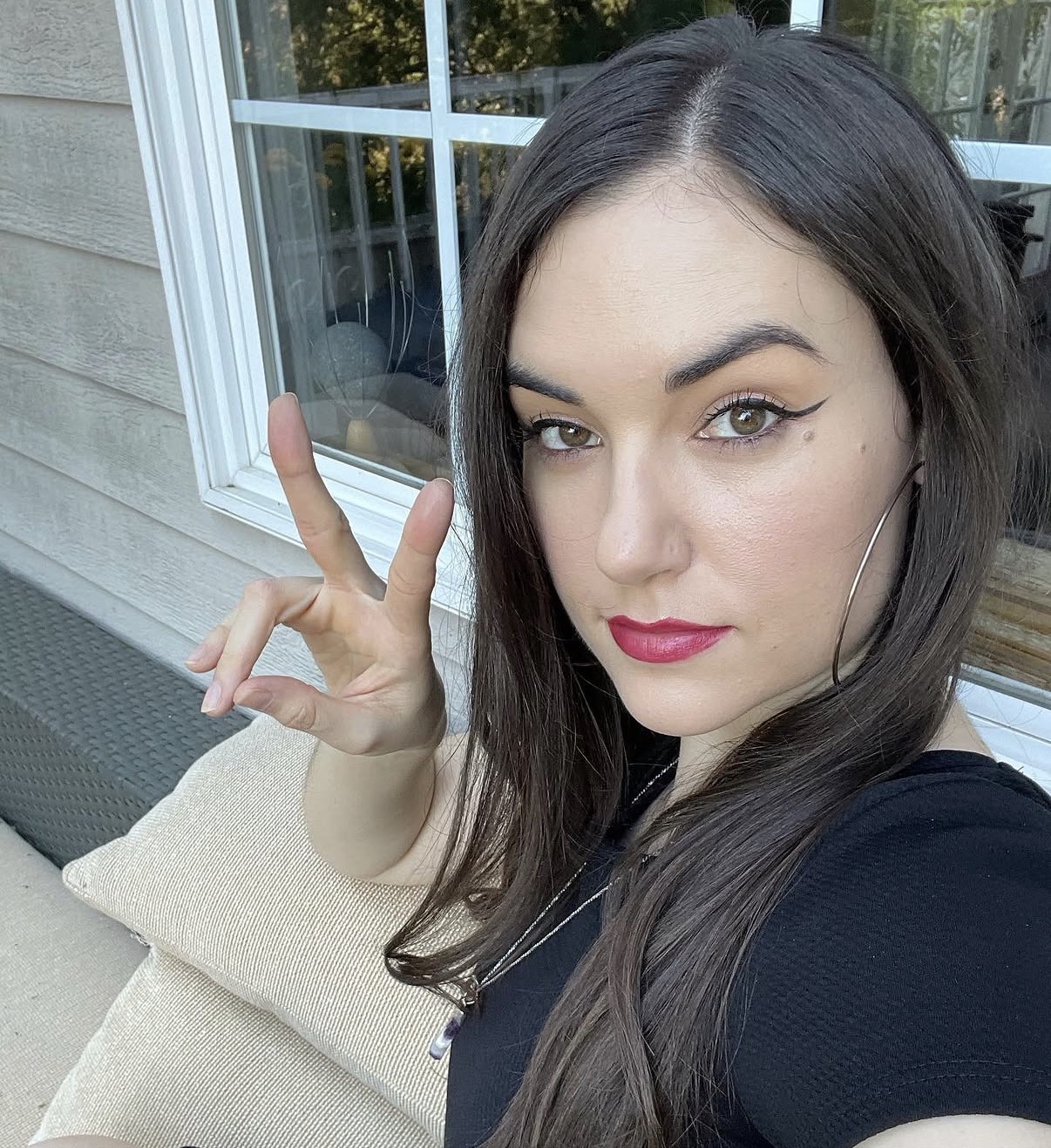 Sasha Grey casual peace sign selfie with modern social media influencer aesthetic