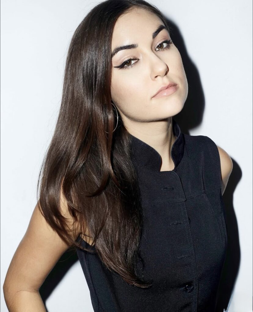 Sasha Grey brunette beauty portrait with elegant black sleeveless fashion styling