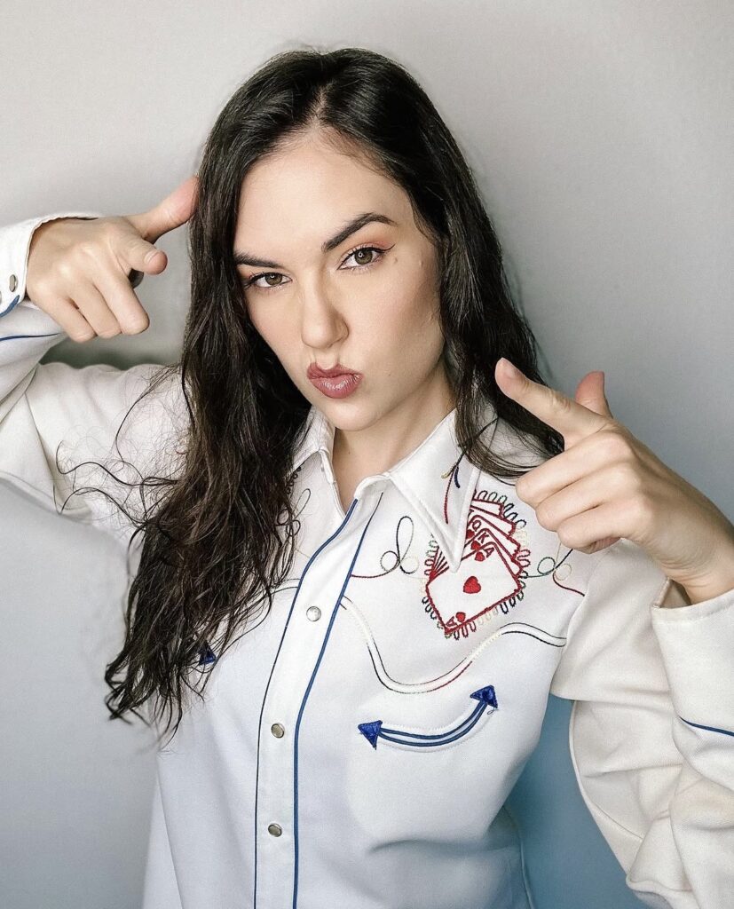 Sasha Grey playful fashion portrait in white outfit with social media creator aesthetic