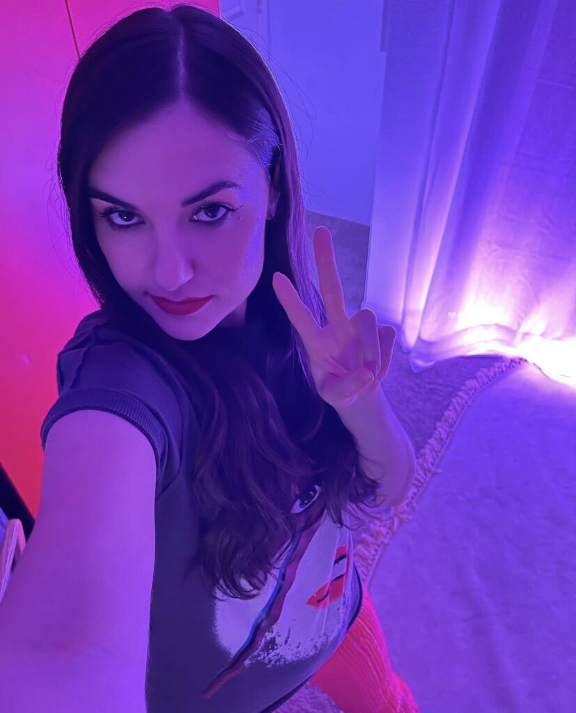 Sasha Grey purple neon room selfie with modern influencer style aesthetic