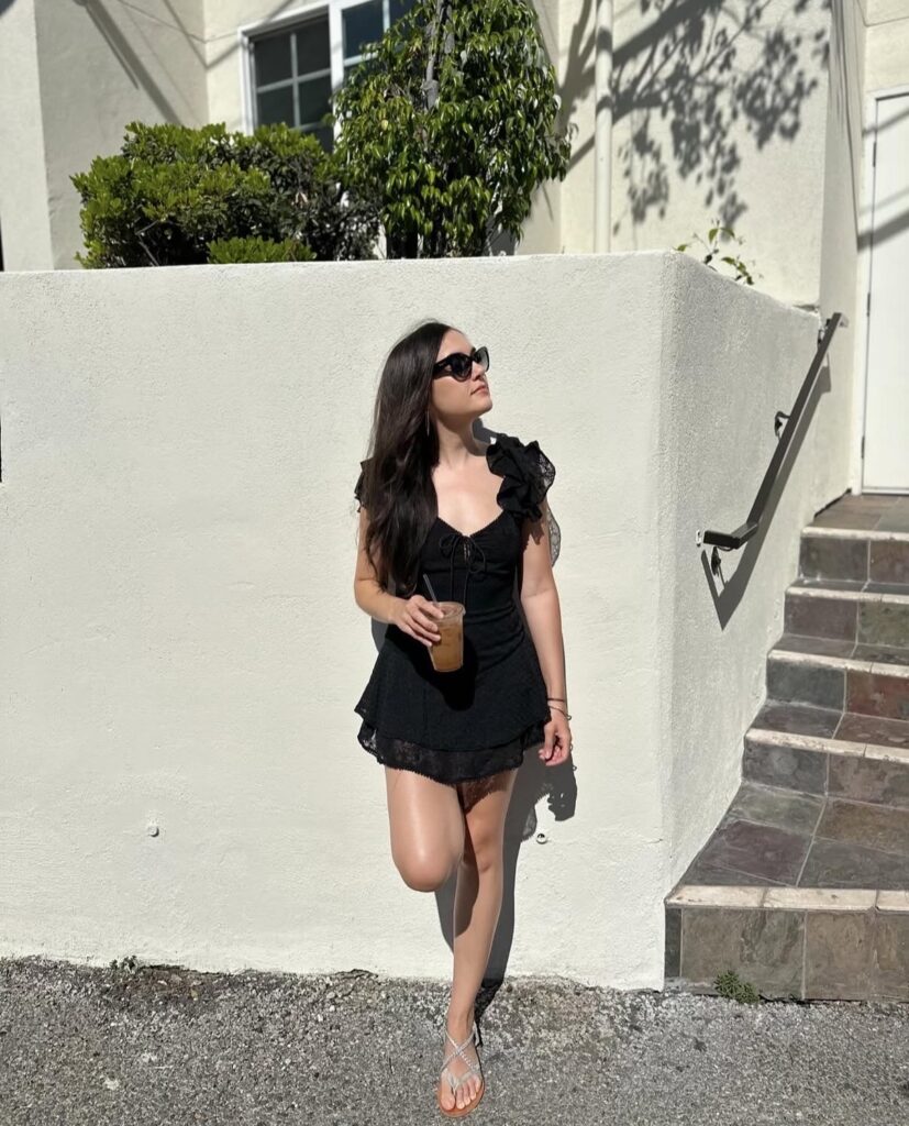 Sasha Grey luxury black dress fashion portrait with influencer lifestyle aesthetic