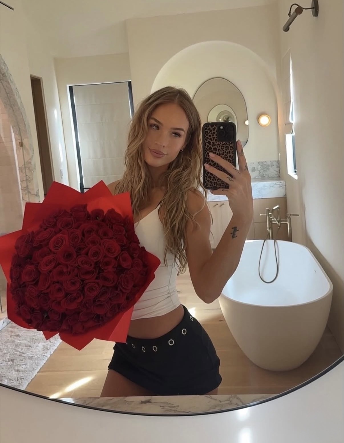 Sky Bri mirror selfie with roses bouquet and luxury influencer lifestyle aesthetic